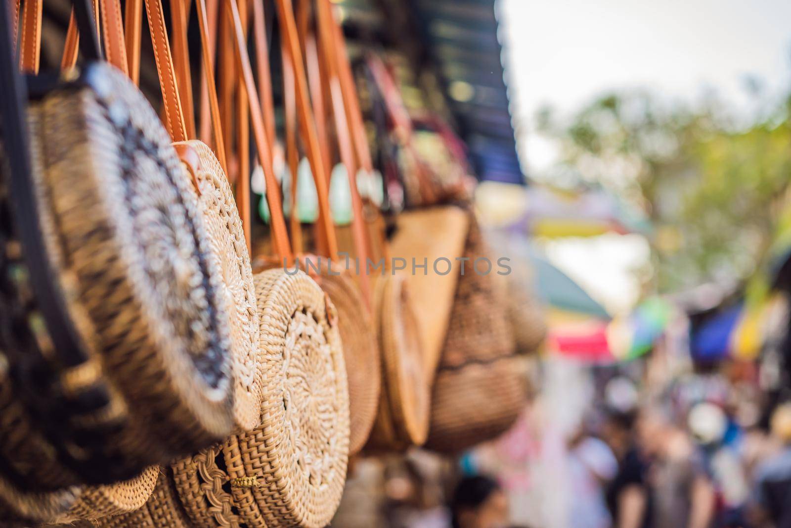 Typical souvenir shop selling souvenirs and handicrafts of Bali at the famous Ubud Market, Indonesia. Balinese market. Souvenirs of wood and crafts of local residents.