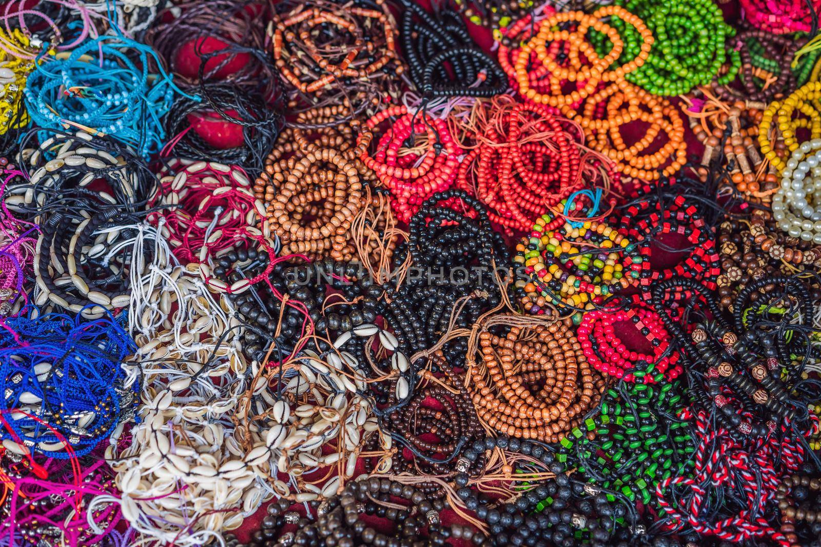 Typical souvenir shop selling souvenirs and handicrafts of Bali at the famous Ubud Market, Indonesia. Balinese market. Souvenirs of wood and crafts of local residents.