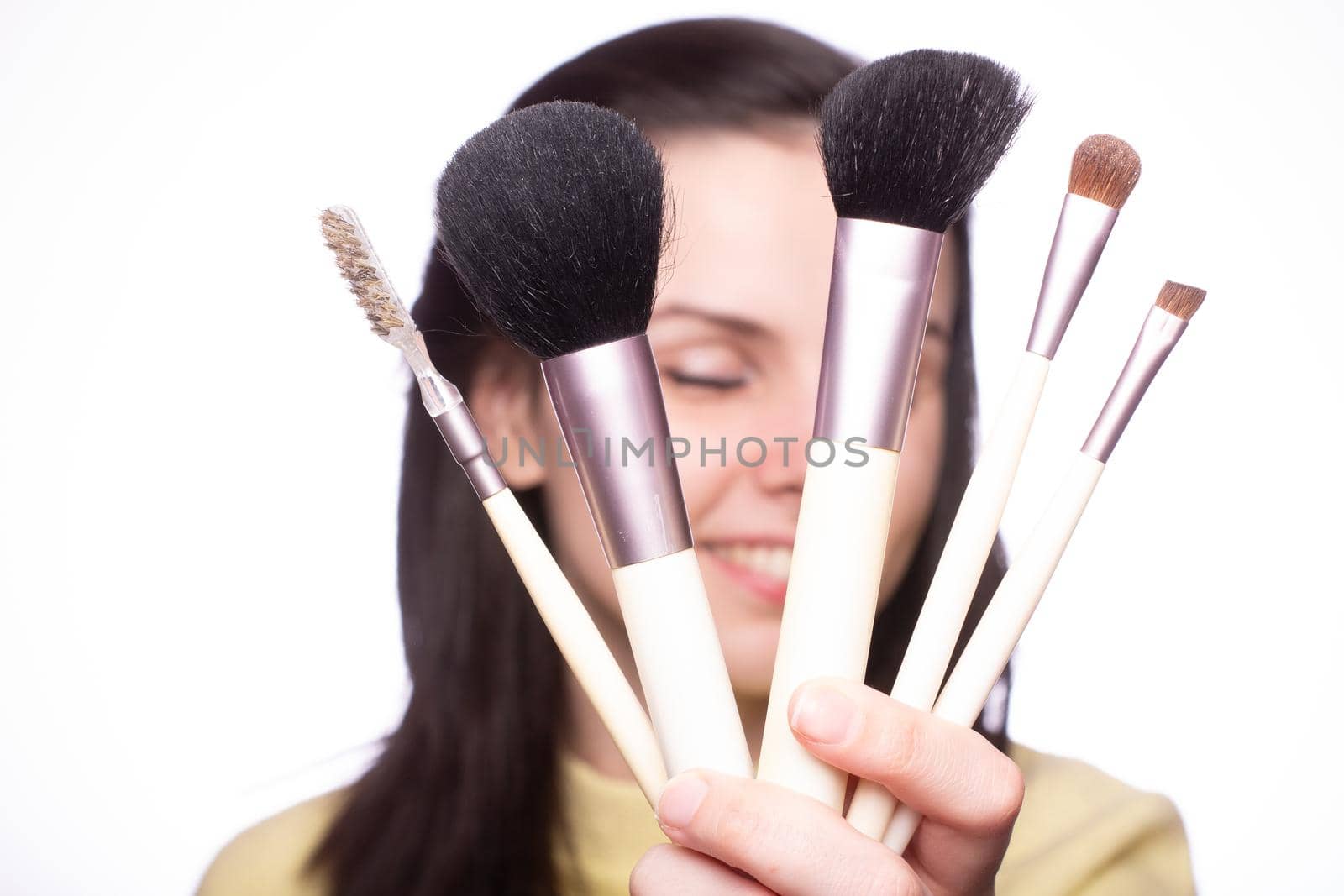 attractive young woman doing makeup. High quality photo