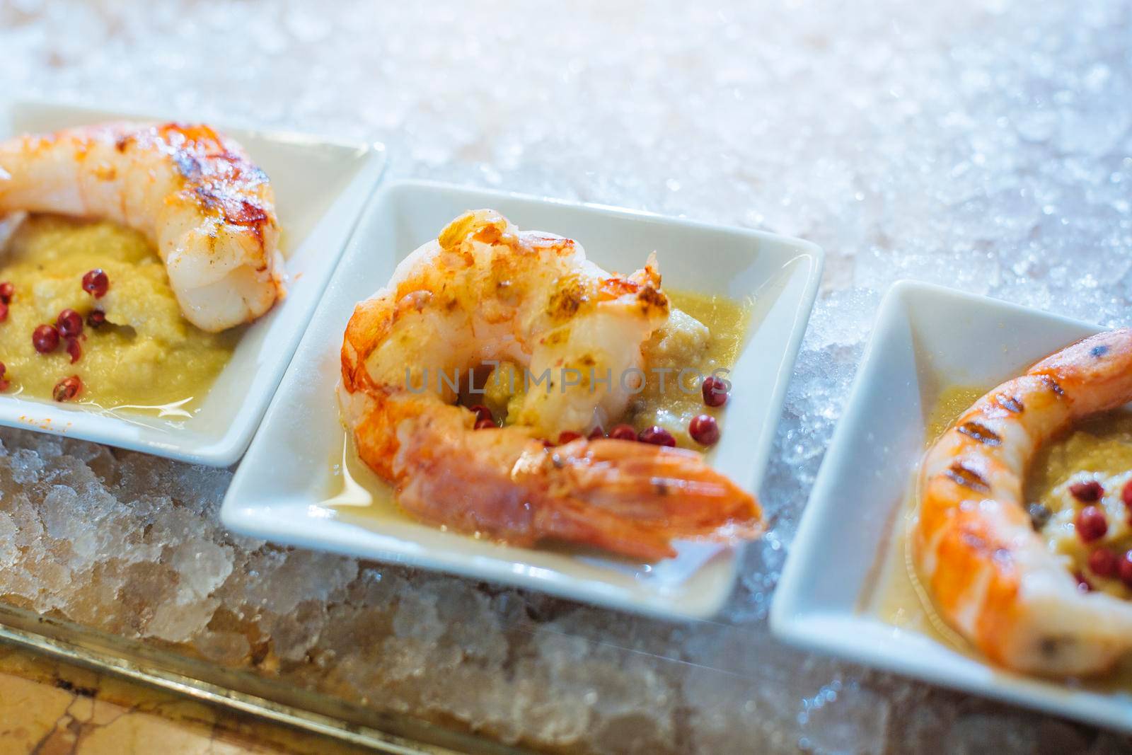 Venetian cicchetti are small dishes as tapas. This is Polenta and Shrimp. Polenta is corn flour cooked in boiling salted water, with a typical shrimps of the Laguna and Adriatic Sea.