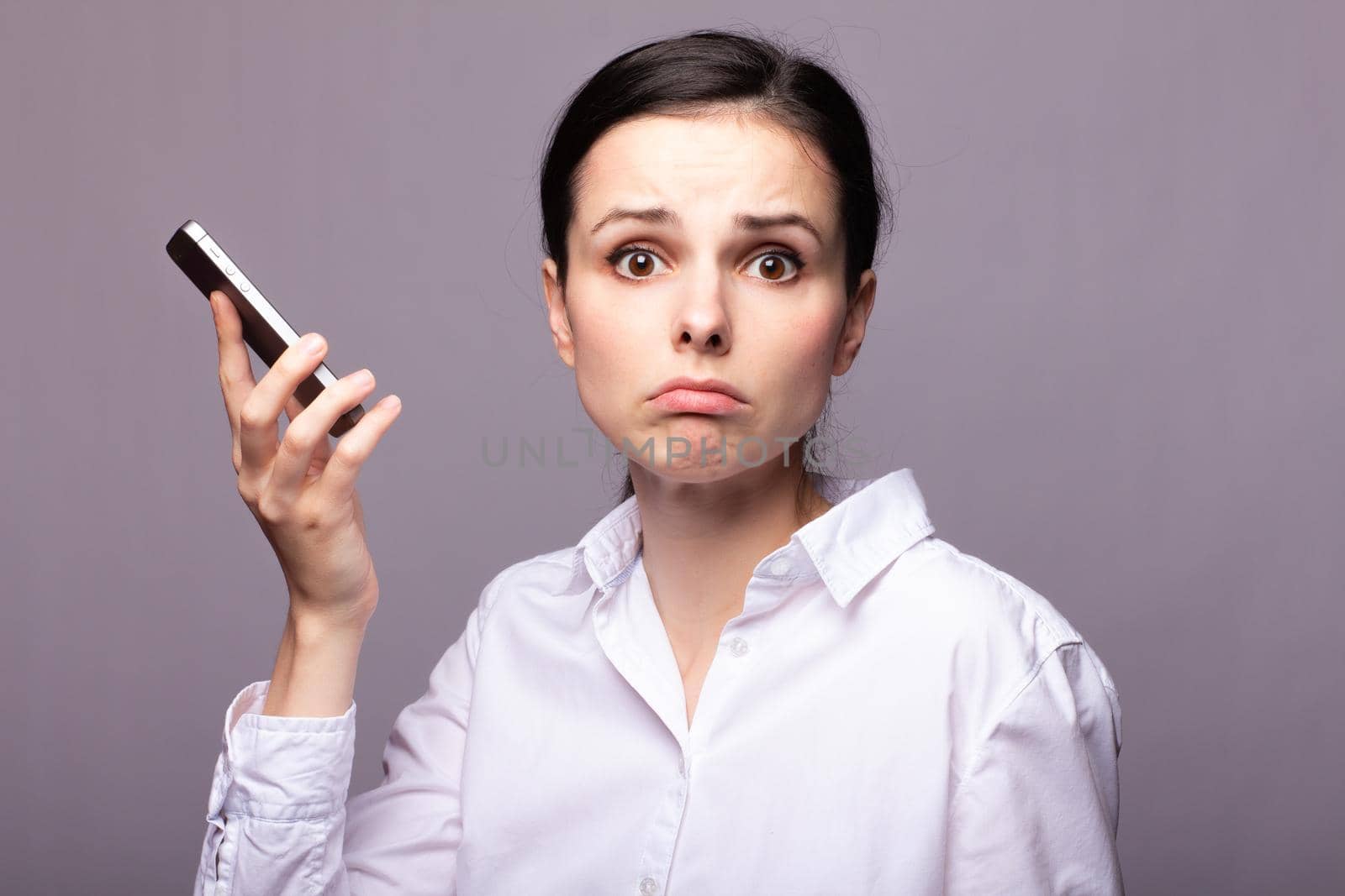 woman in a white shirt and glasses communicates on the phone. High quality photo