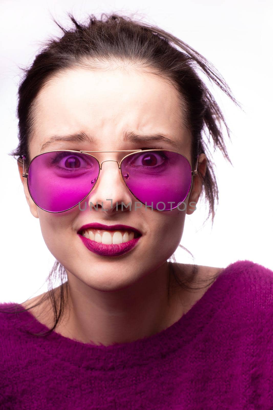 woman in purple sweater, purple glasses with purple lipstick on her lips by shilovskaya