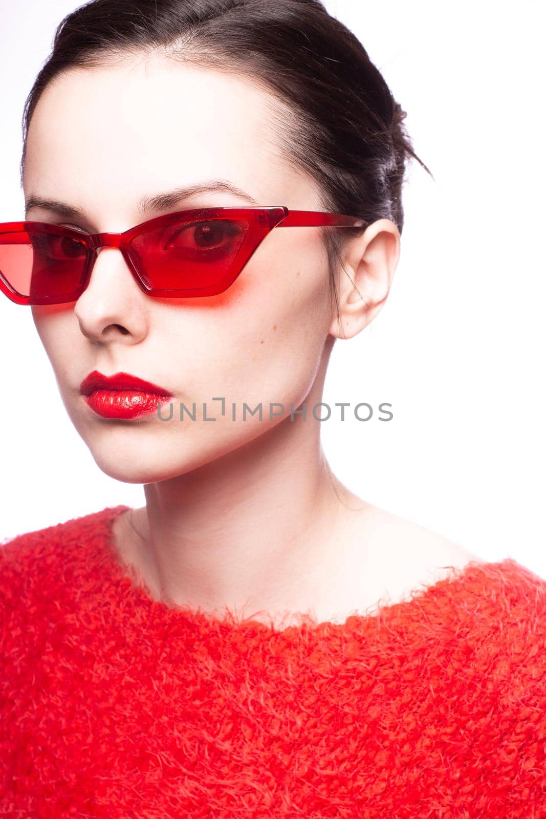 emotional brunette woman in red sunglasses, red nails, red lipstick, white background by shilovskaya