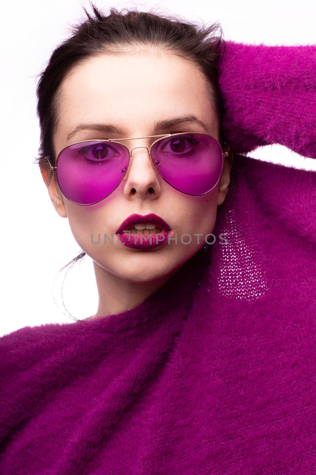 woman in purple sweater, purple glasses with purple lipstick on her lips by shilovskaya