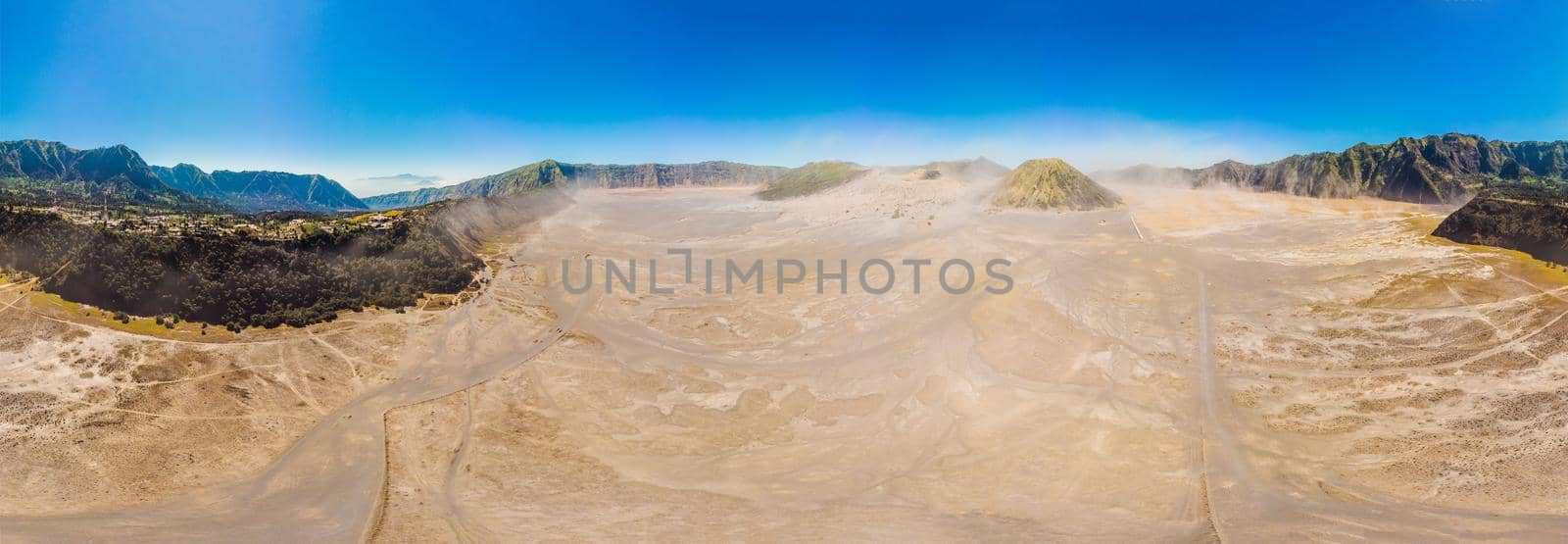 Panoramic Aerial shot of the Bromo volcano and Batok volcano at the Bromo Tengger Semeru National Park on Java Island, Indonesia. One of the most famous volcanic objects in the world. Travel to Indonesia concept by galitskaya