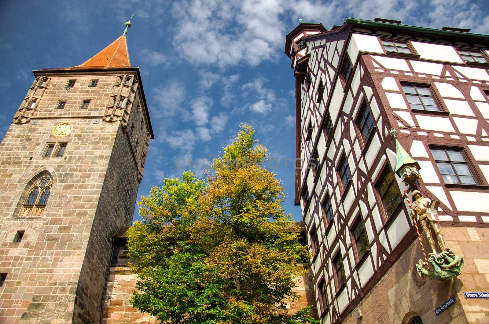 Old medieval Tower Tiergartnertorturm and traditional buildings on the streets of Nuremberg Nurnberg city, Mittelfranken region, Bavaria, Germany