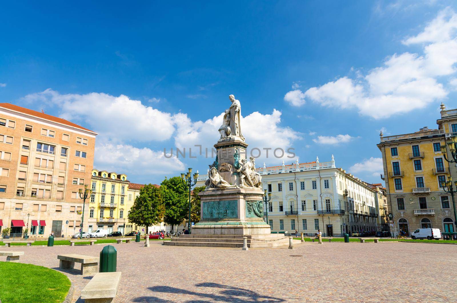 Monumento a Camillo Benso conte di Cavour statue on Piazza Carlo Emanuele II square with old buildings around in historical city centre of Turin Torino city in beautiful summer day, Piedmont, Italy