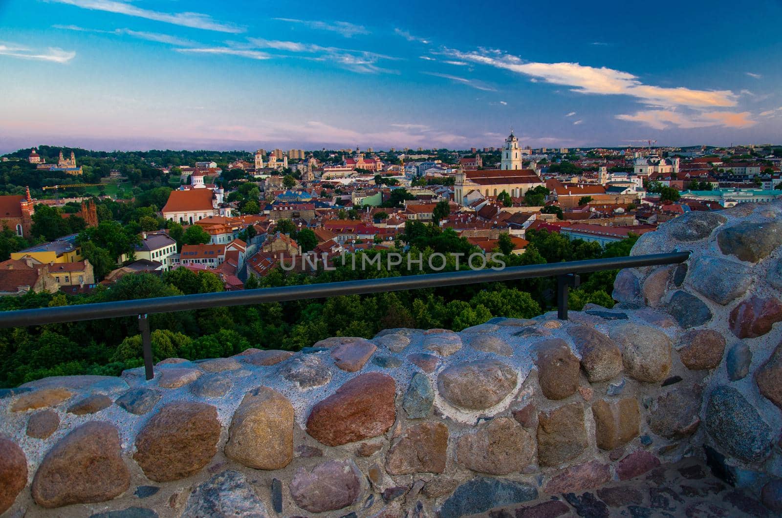 Panoramic view of Vilnius old town center with old buildings, churches and green trees from the Hill of Castle Tower Of Gediminas (Gedimino), Lithuania