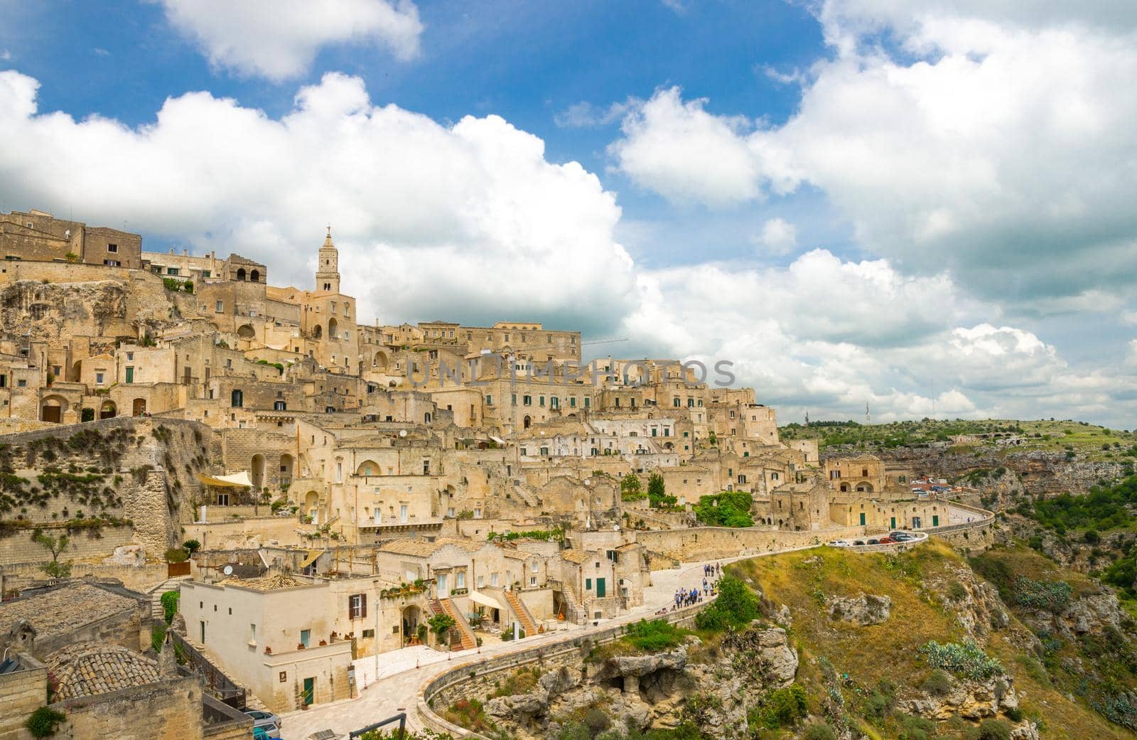 Matera panoramic view of historical centre Sasso Caveoso Sassi old ancient town with rock houses with blue sky white clouds, European Culture Capital, UNESCO World Heritage, Basilicata, Southern Italy
