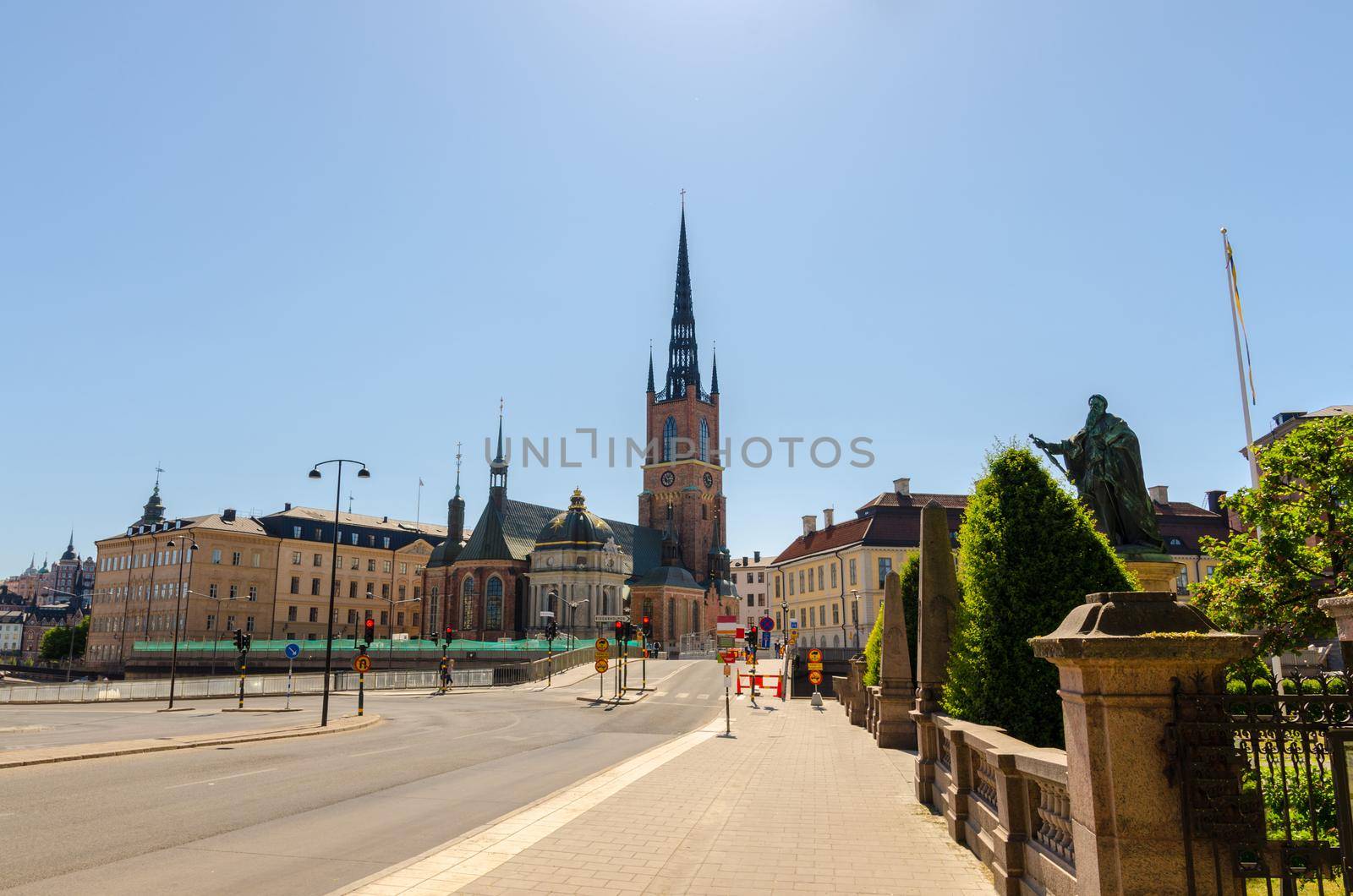 Riddarholmen district, Riddarholm Church with spire and typical sweden gothic buildings with clear blue sky copy space, Stockholm, Sweden