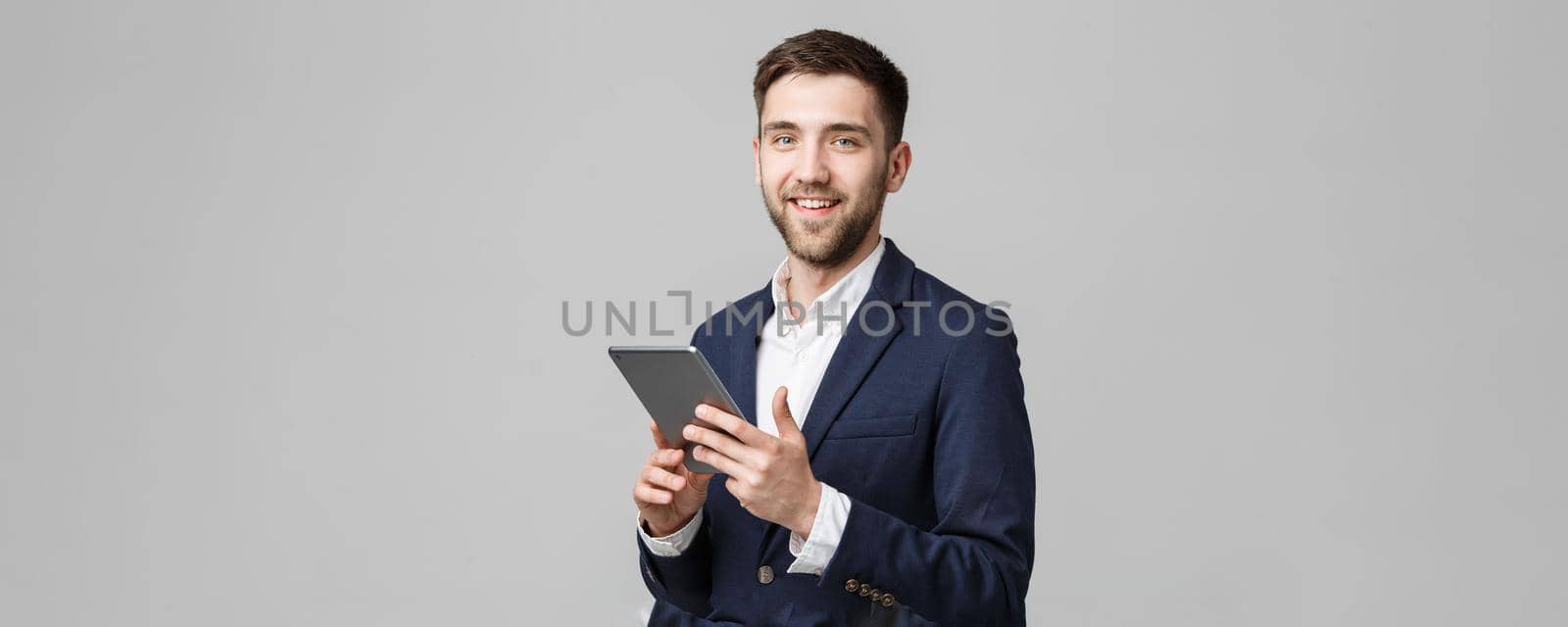 Business Concept - Portrait Handsome Business man playing digital tablet with smiling confident face. White Background. Copy Space.