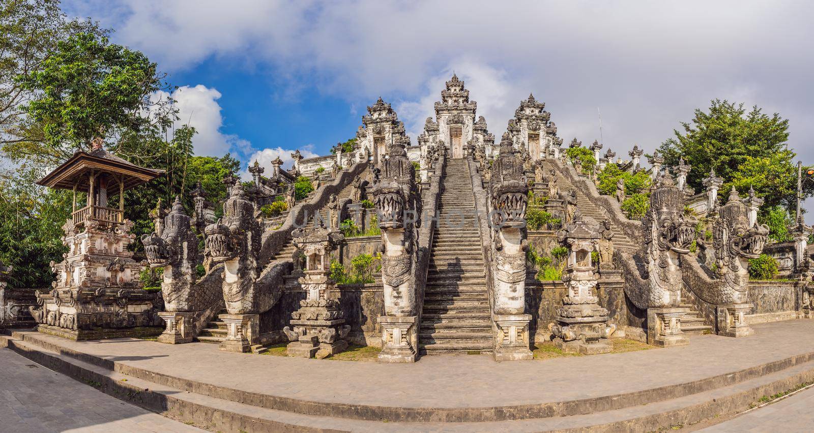 Three stone ladders in beautiful Pura Lempuyang Luhur temple. Summer landscape with stairs to temple. Paduraksa portals marking entrance to middle sanctum jaba tengah of Pura Penataran Agung, Bali.