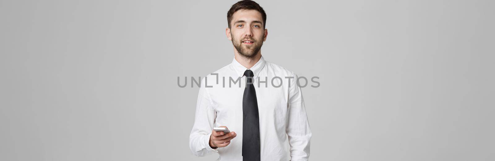Lifestyle and Business Concept - Portrait of a handsome businessman enjoy talking with mobile phone. Isolated White background. Copy Space.