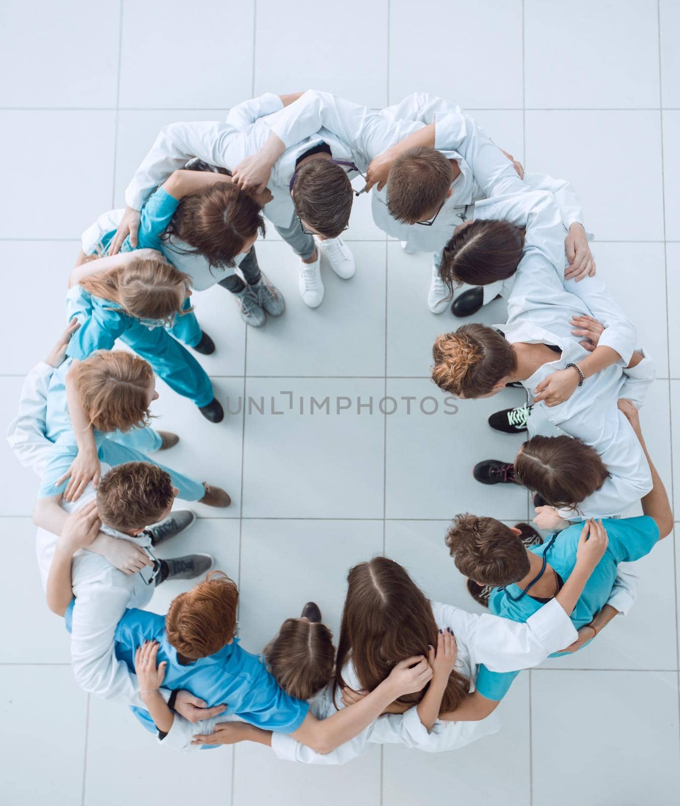 group of young medical professionals applauding their leader. success concept