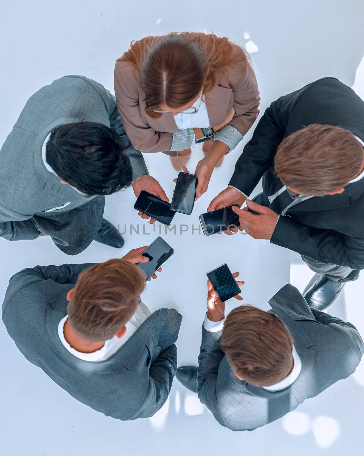 top view .business team using their smartphones.people and technology