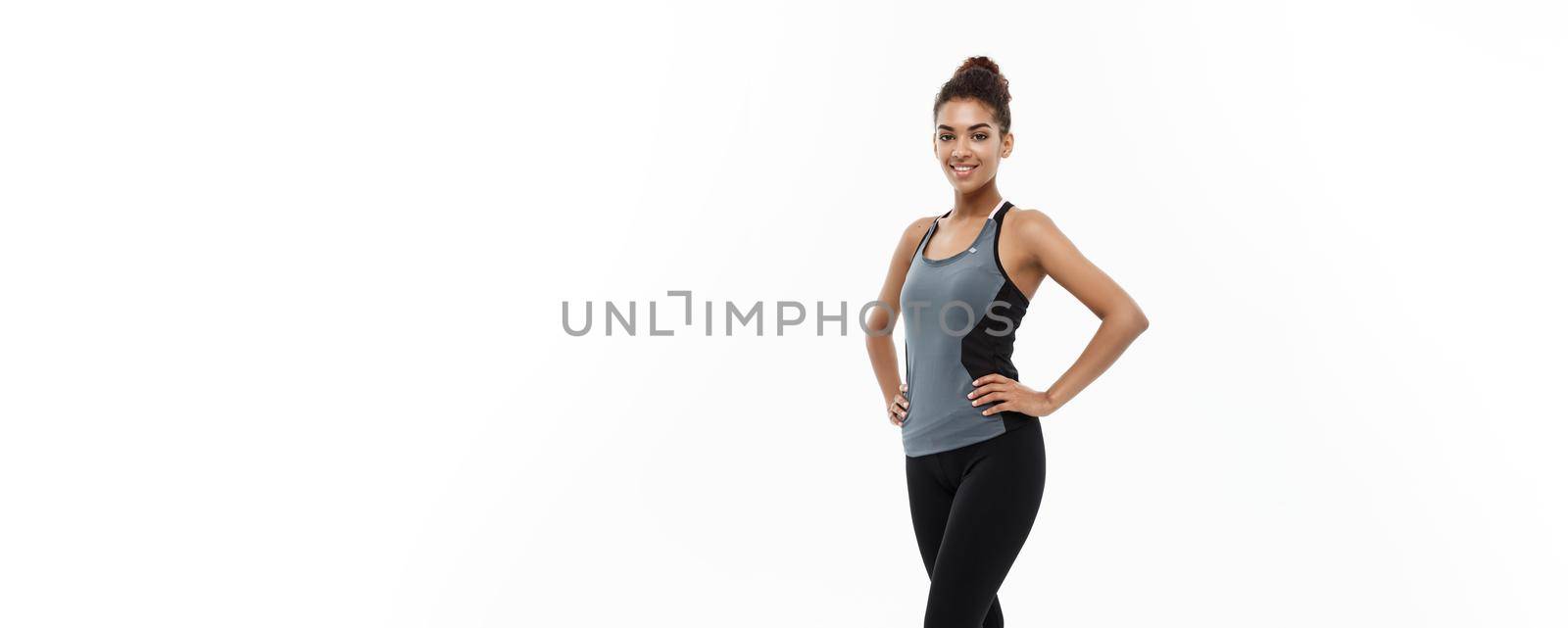 Healthy and Fitness concept - portrait of African American girl posing with fitness clothes