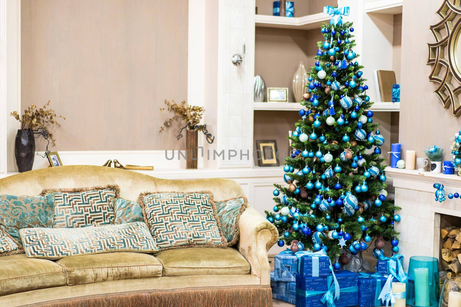 Beautiful New Year Interior with Christmas Tree in Corner. Couch with Pillows and Green Christmas Tree with Beautiful Presents.