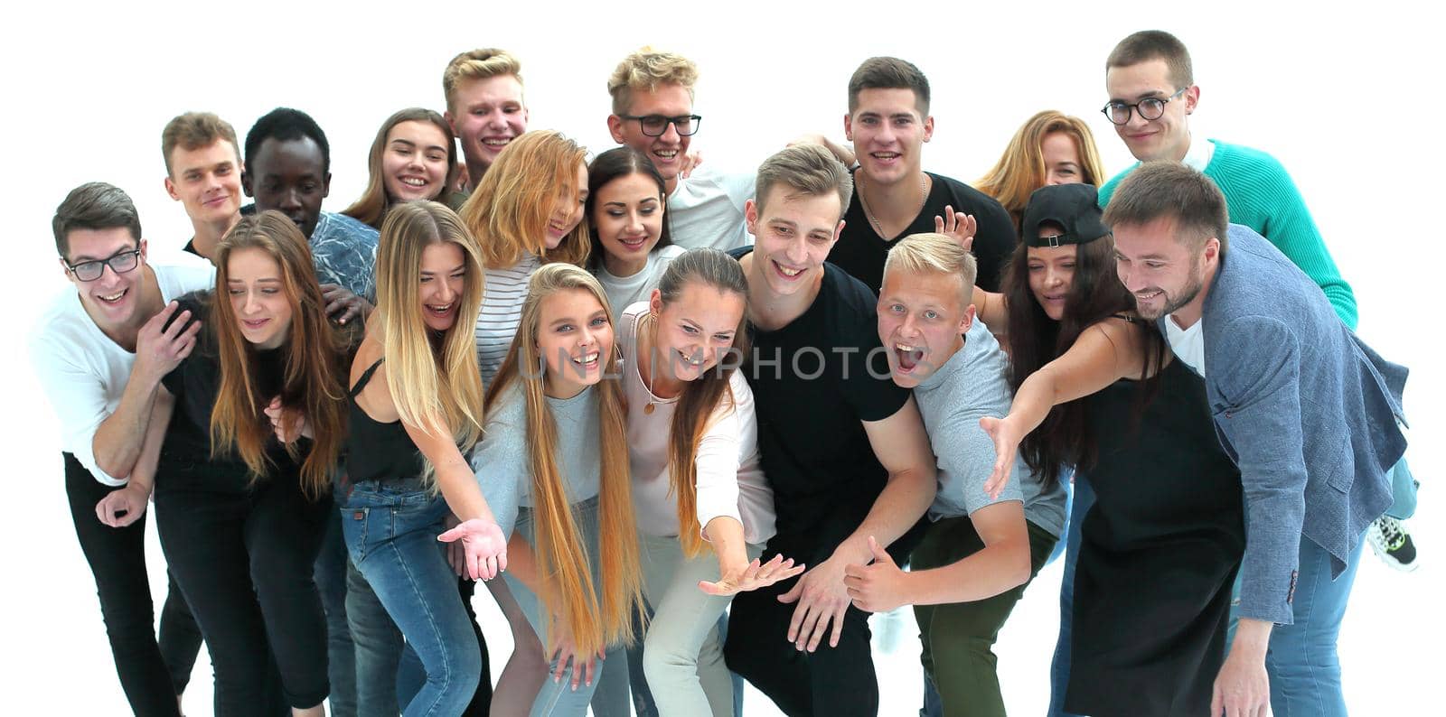 in full growth. group of cheerful young people looking at the camera. isolated on white