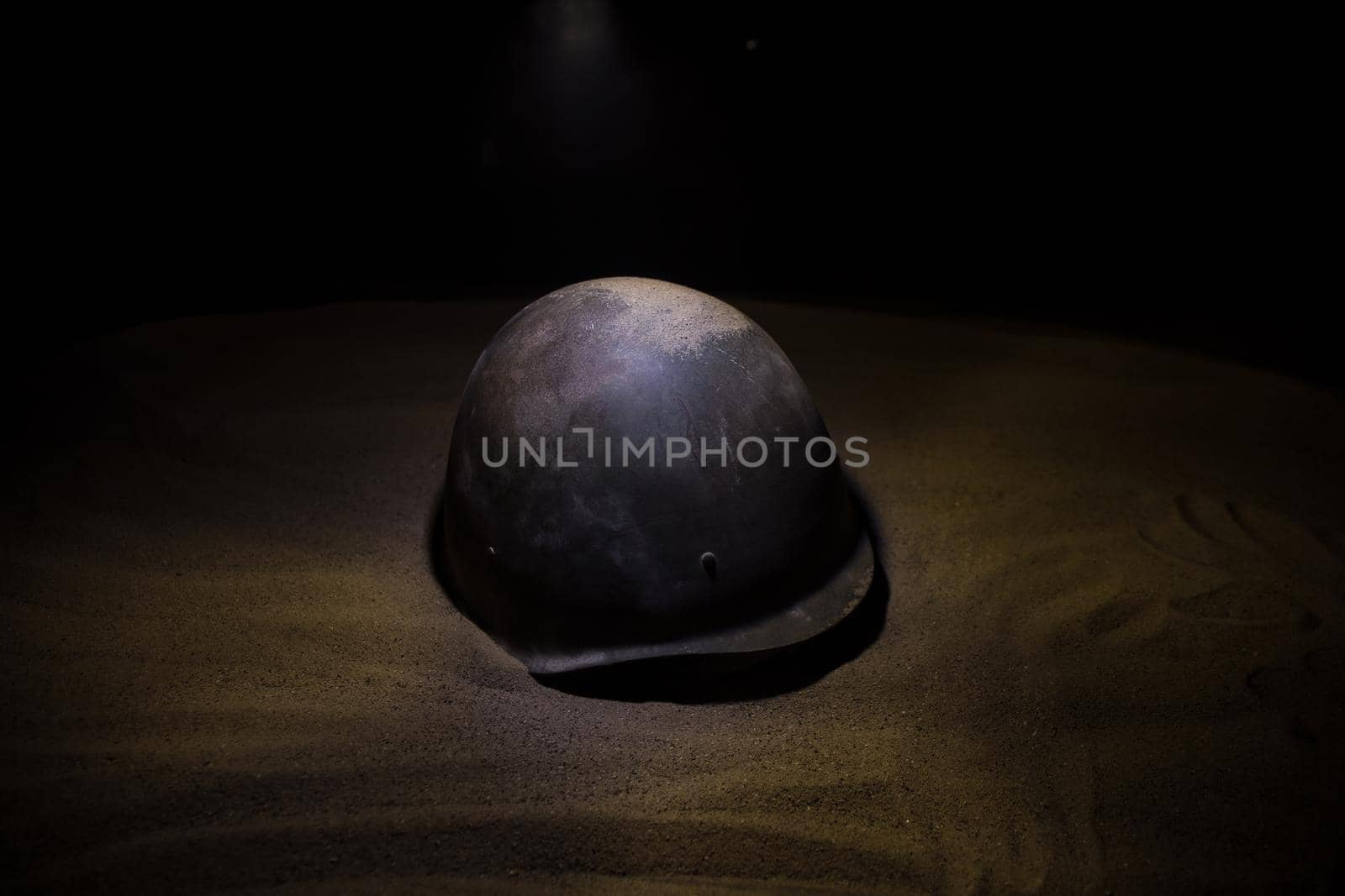 Soviet army Helmet Second World War in dark. Selective focus by Zeferli