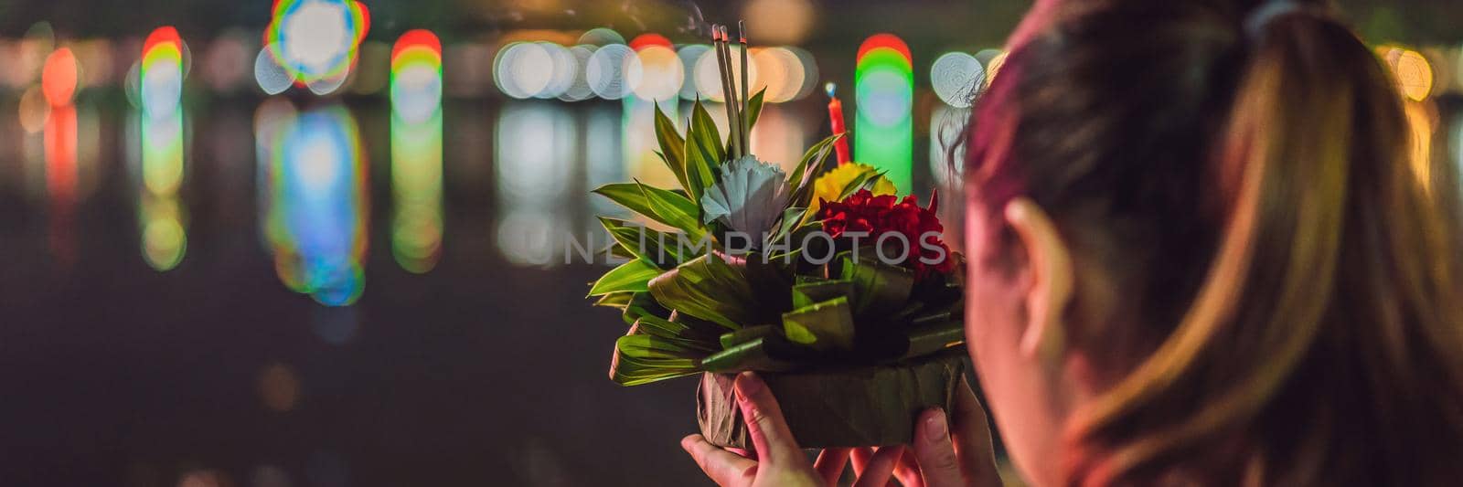 Loy Krathong festival, People buy flowers and candle to light and float on water to celebrate the Loy Krathong festival in Thailand BANNER, LONG FORMAT by galitskaya