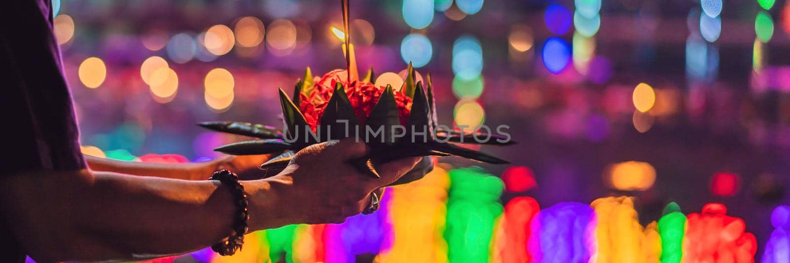 Loy Krathong festival, People buy flowers and candle to light and float on water to celebrate the Loy Krathong festival in Thailand. BANNER, LONG FORMAT