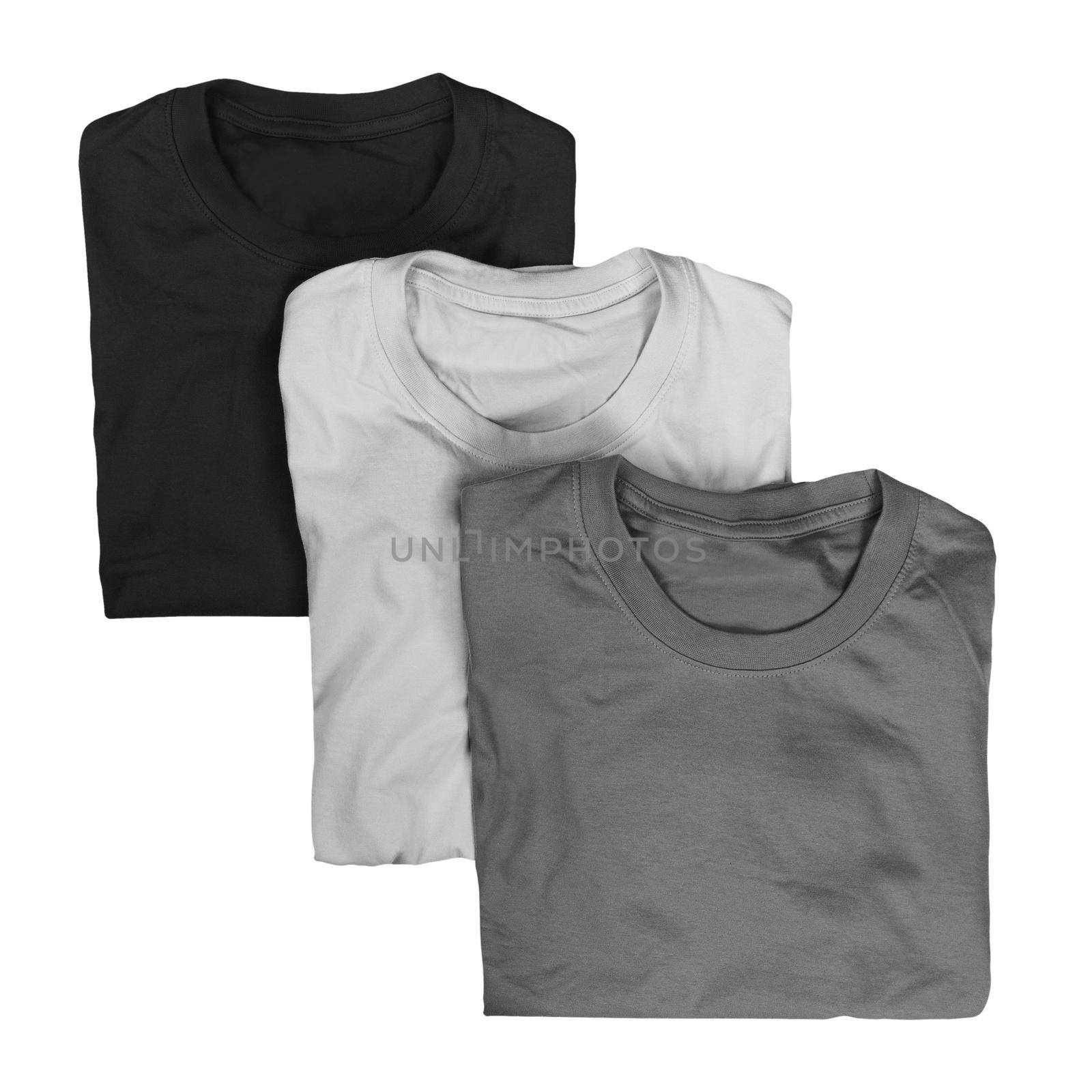 Collection of three folded t-shirts isolated on white background by dmitryz