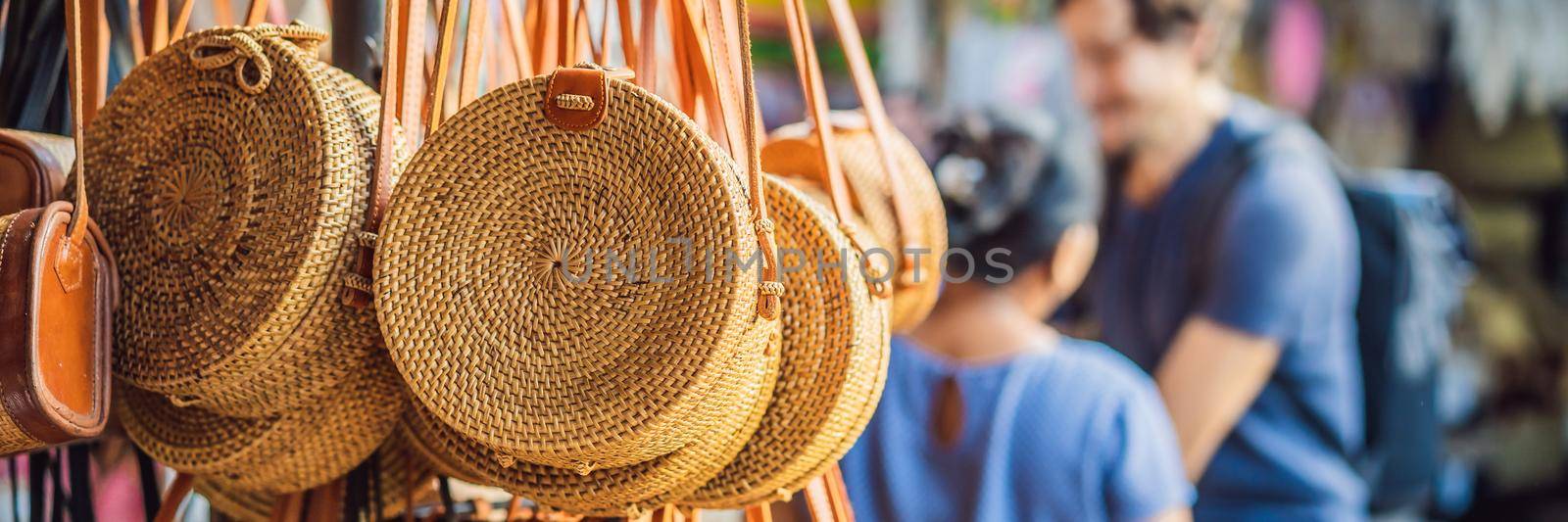 Typical souvenir shop selling souvenirs and handicrafts of Bali at the famous Ubud Market, Indonesia. Balinese market. Souvenirs of wood and crafts of local residents. BANNER, LONG FORMAT