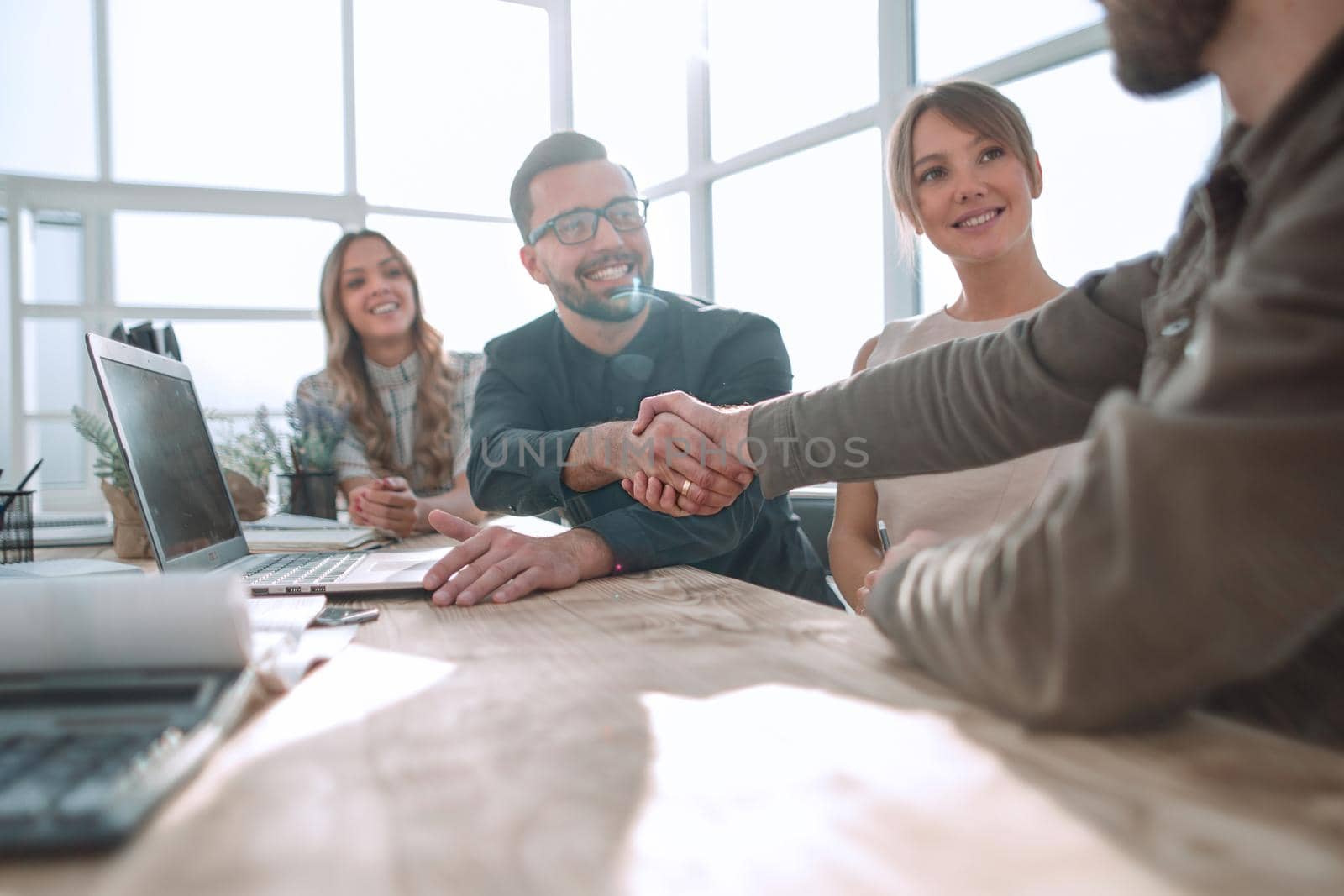 handshake business people at a meeting in the office. the concept of partnership .