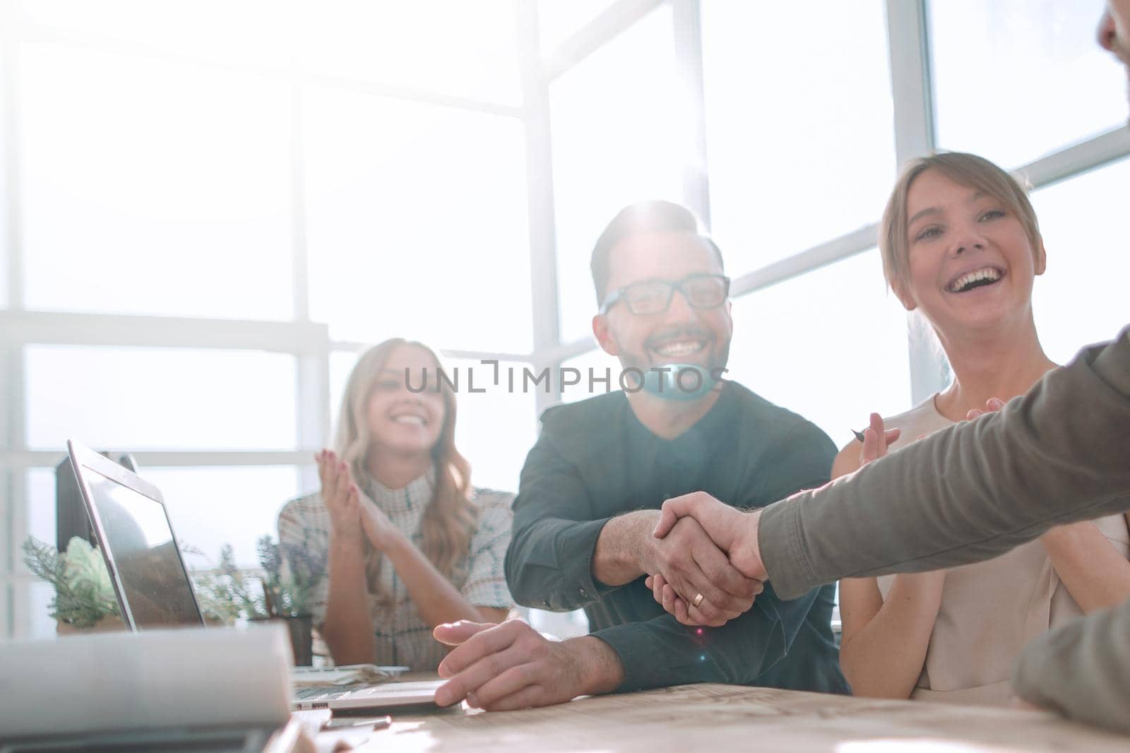 handshake business people at a meeting in the office. the concept of partnership .
