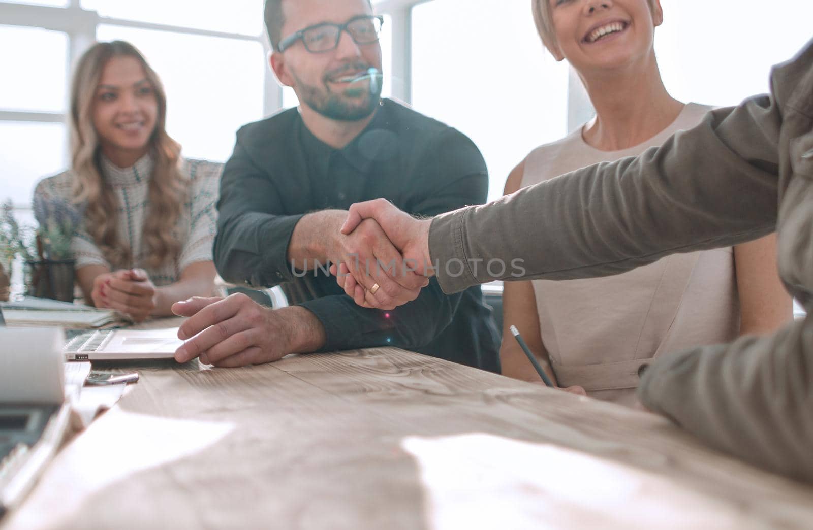 handshake business people at a meeting in the office. the concept of partnership .