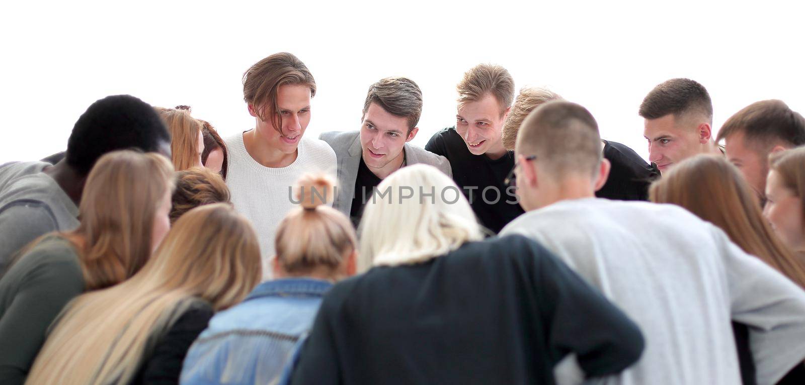 team of young people standing in a circle. by asdf