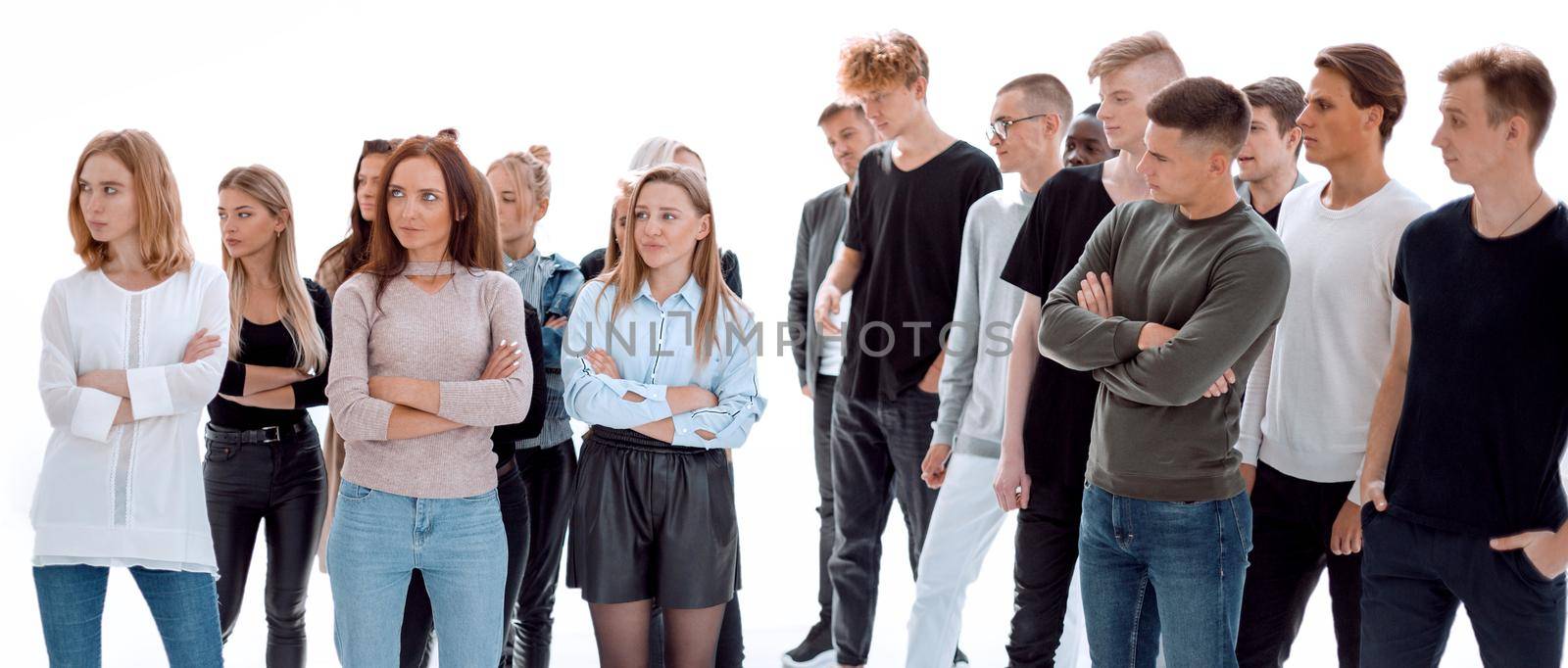 in full growth. young men looking at a group of women.isolated on white background