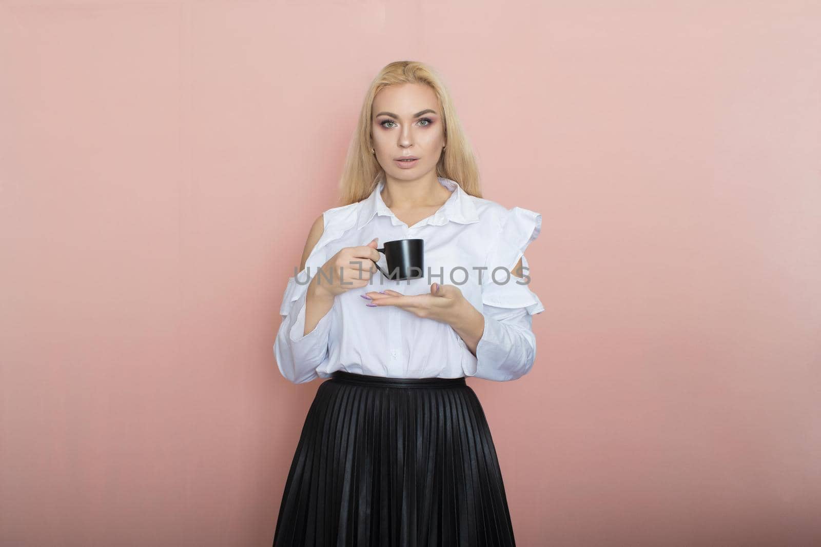 Office woman holding cup of tea or coffee by Bonda