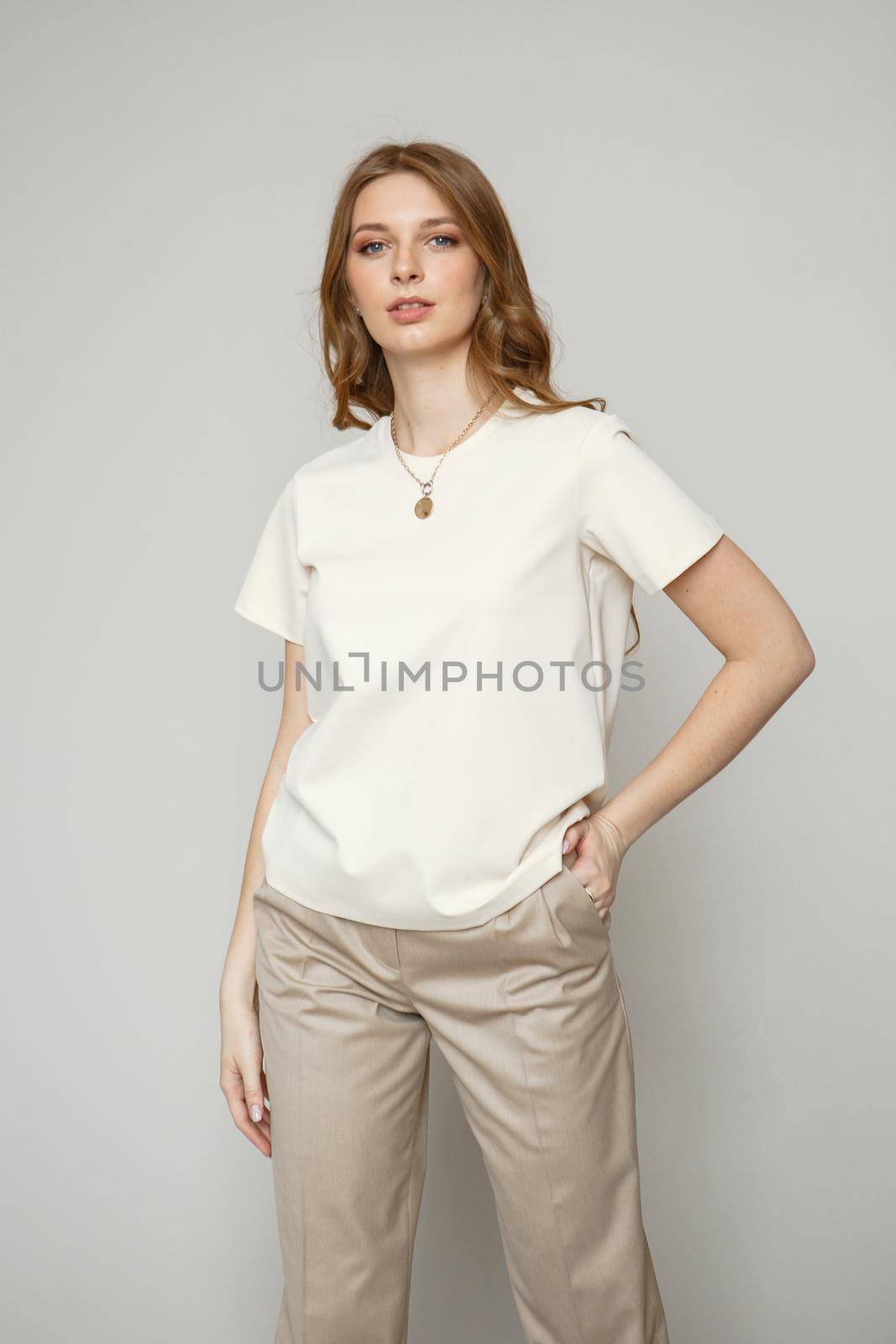A model in brown casual clothes on a studio background. Shooting fashion clothes by deandy