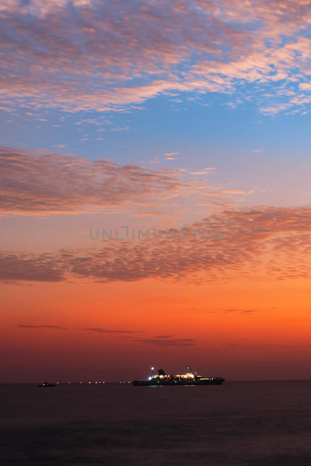 Colorful sunset view from Galle Dutch fort evening, sailboat in the horizon, after sundown blue hour, long exposure photography. by nilanka