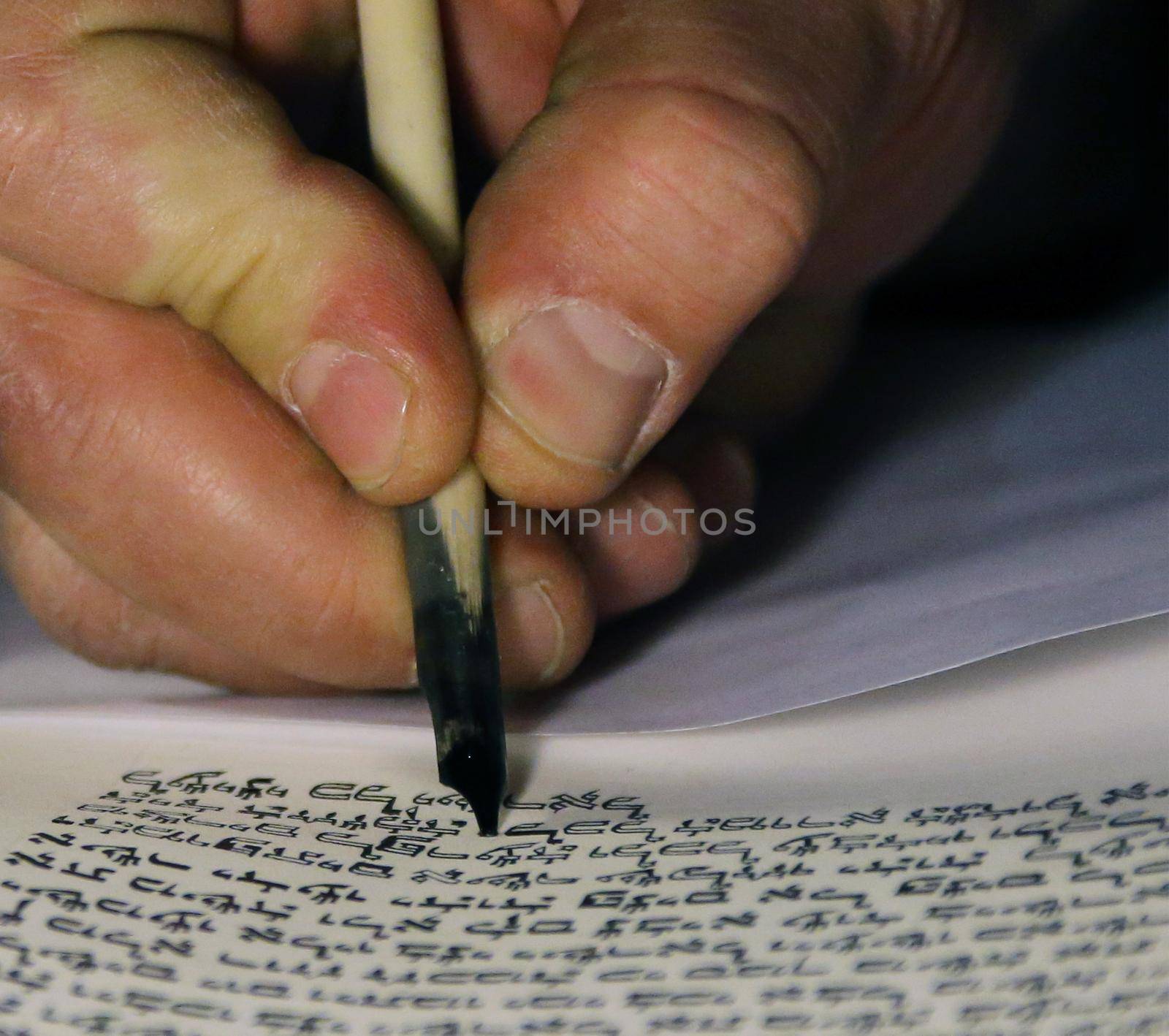 Boy reading Torahjudaism.Torah. A sacred roll which is written in manual