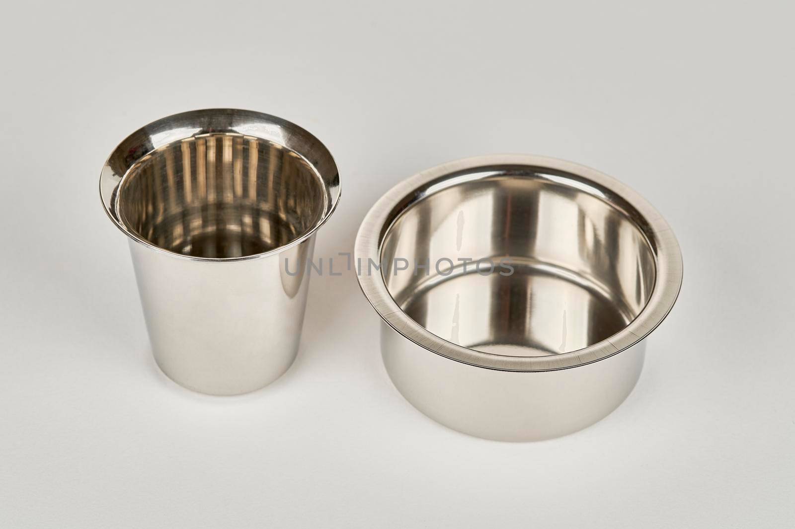 Steel dabarah and tumbler for filfer coffee, on a white background