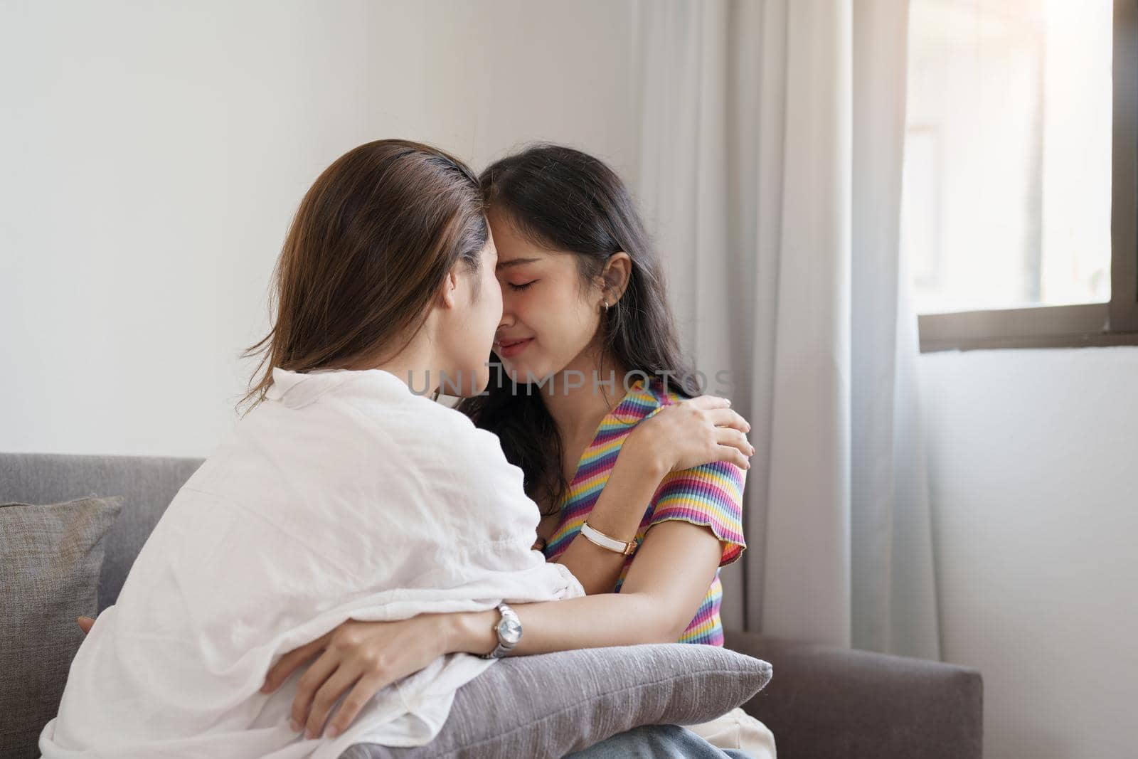 lgbtq, lgbt concept, homosexuality, portrait of two Asian women posing happy together and showing love for each other while being together by Manastrong