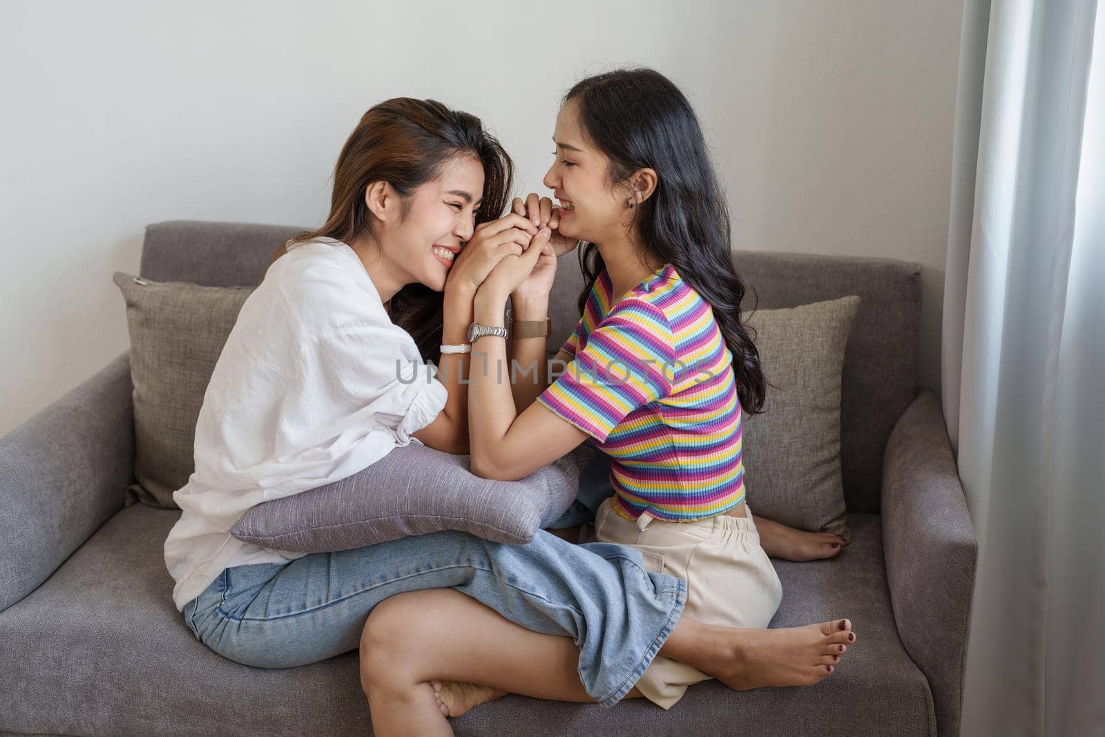 lgbtq, lgbt concept, homosexuality, portrait of two Asian women posing happy together and showing love for each other while being together.