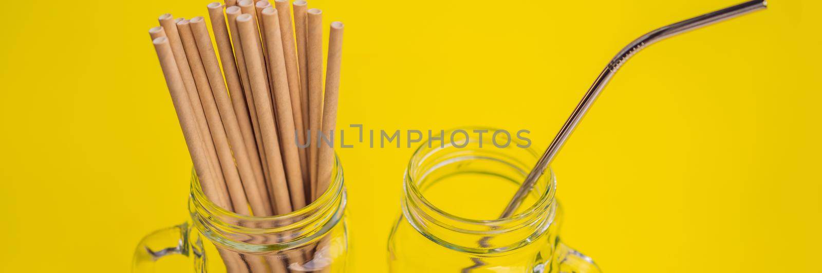 Steel drinking vs disposable straws on a yellow background. Zero waste concept BANNER, LONG FORMAT by galitskaya