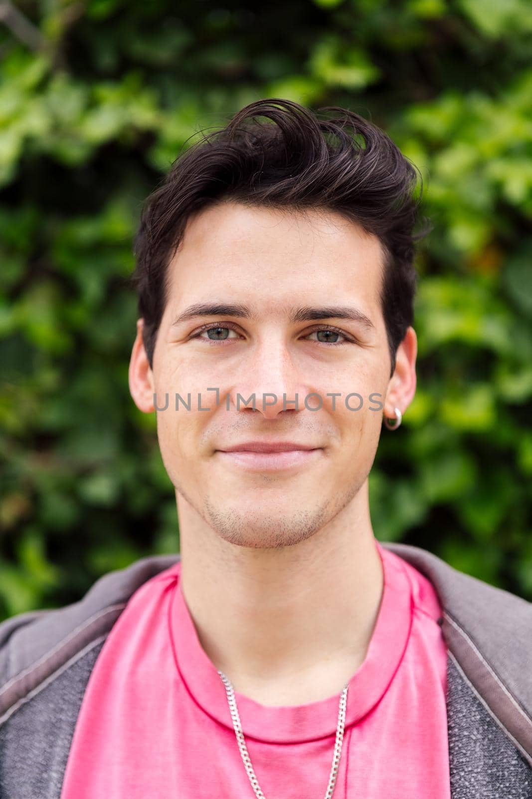 horizontal portrait of a handsome young man smiling, concept of happiness and teenager lifestyle