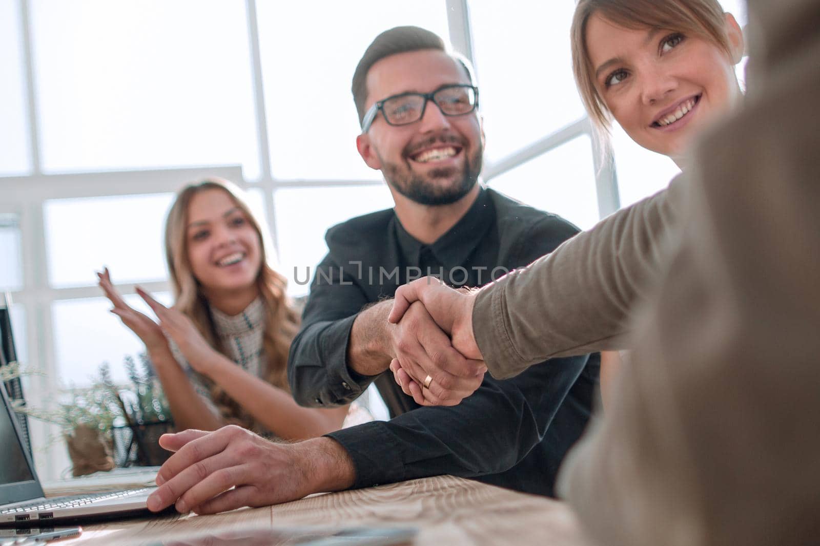 handshake business people at a meeting in the office. the concept of partnership .