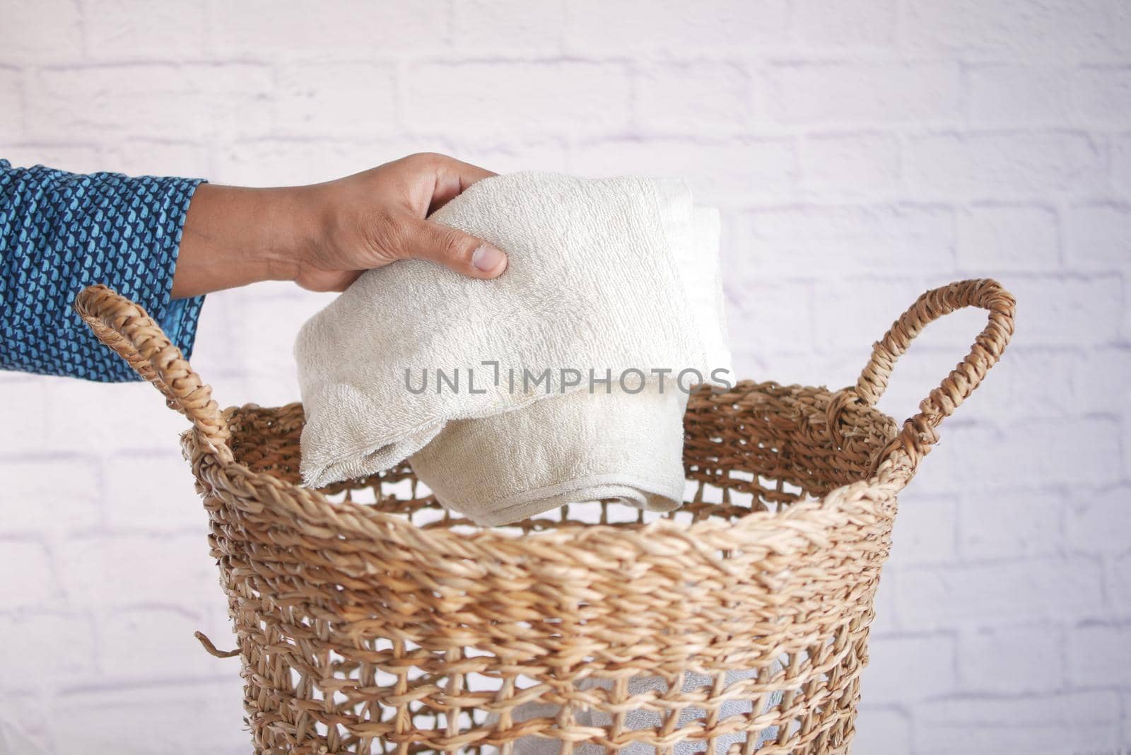 top view of Clothes in basket on floor .