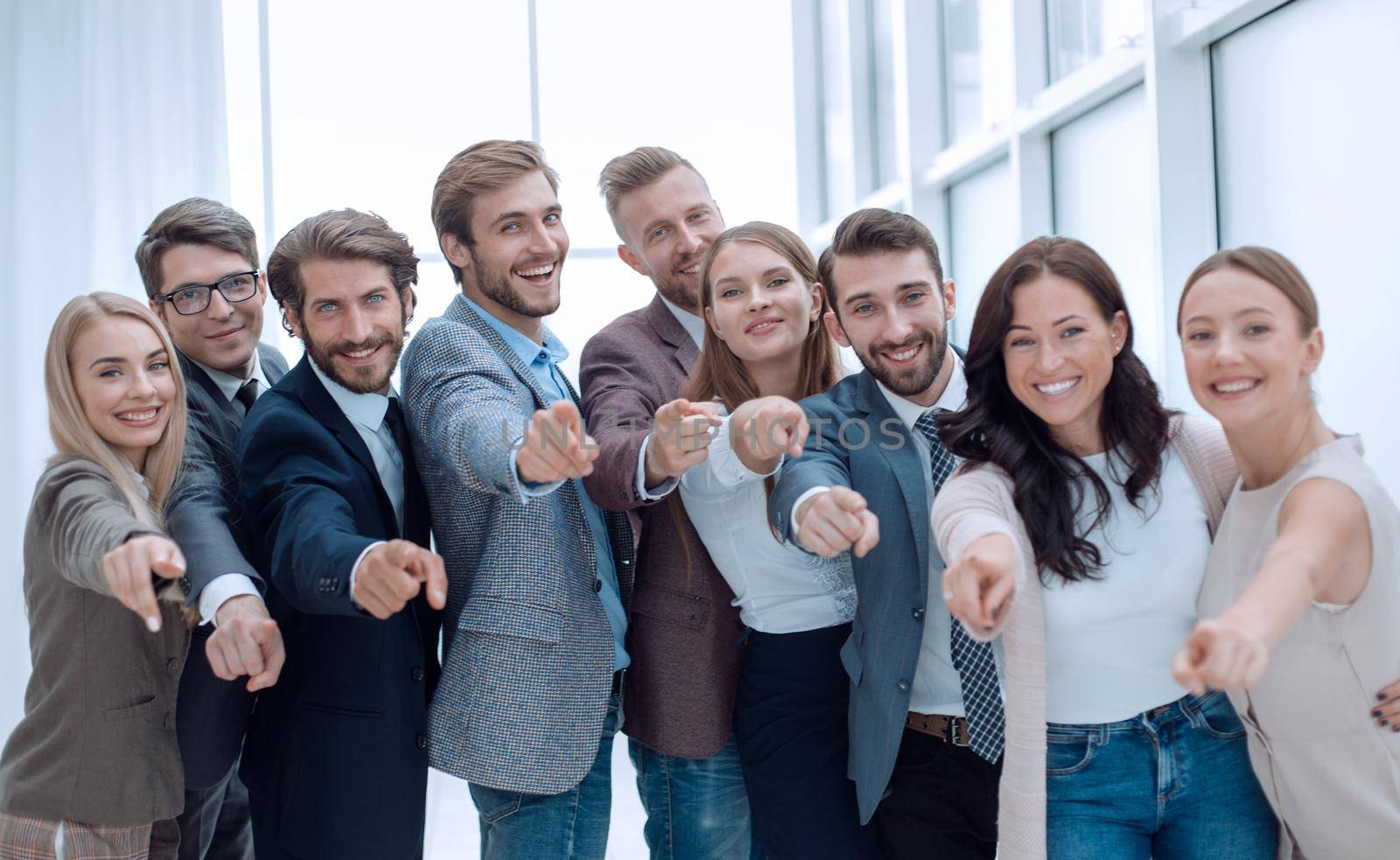 group of successful young people pointing at you. concept of choice