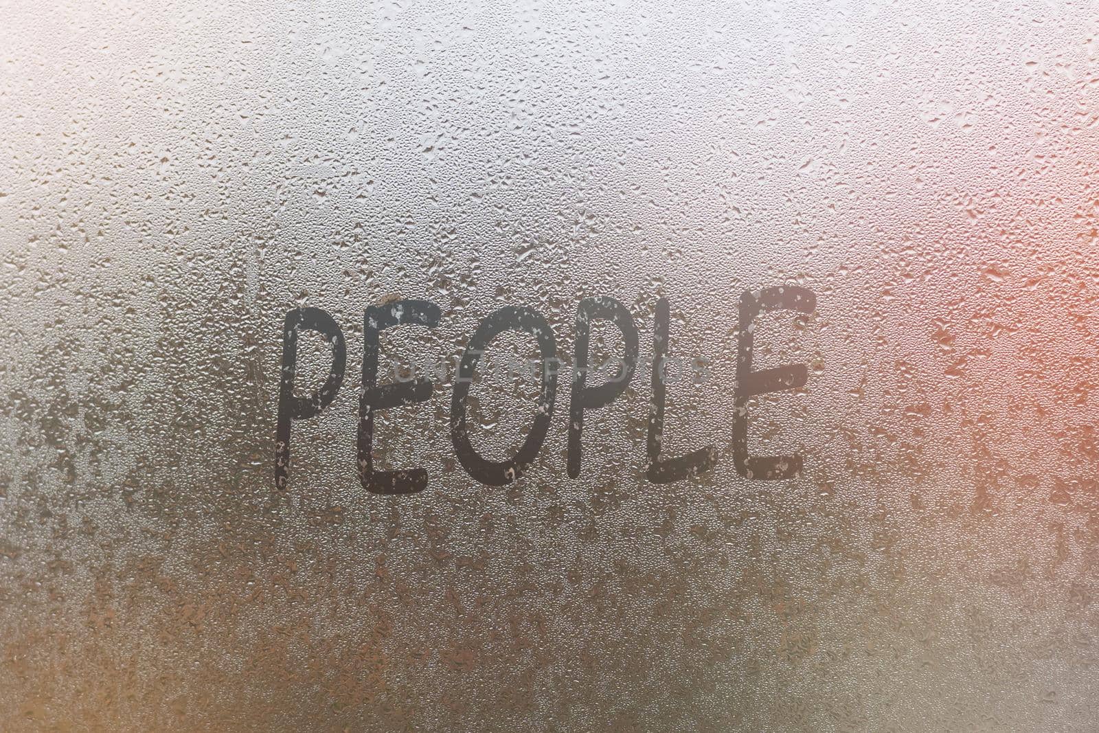 Word - people. Abstract background with drops of water. Inscription on foggy window. Handwritten text on wet glass.