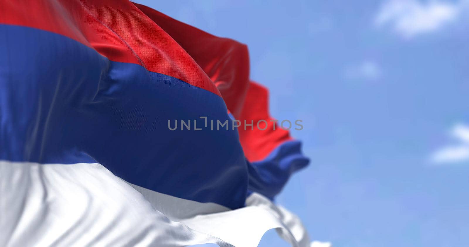 The flag of Republika Srpska waving in the wind on a clear day by rarrarorro