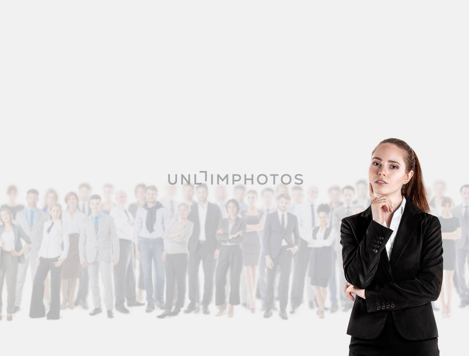 Business woman thinking with her team behind her - isolated over gray background