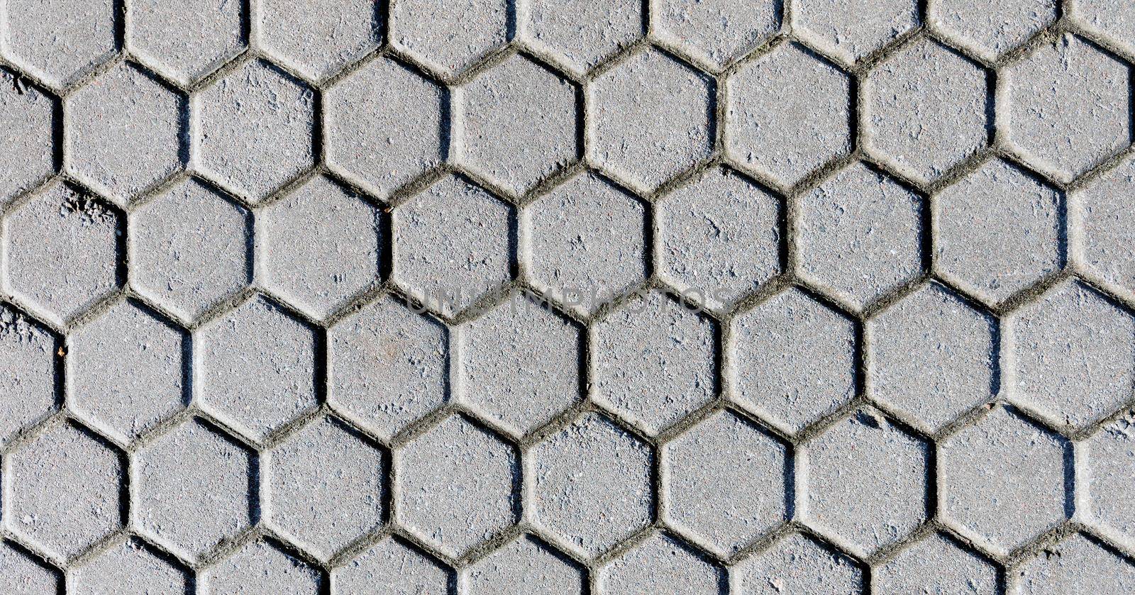 The black and white background image of hexagonal clay tiles