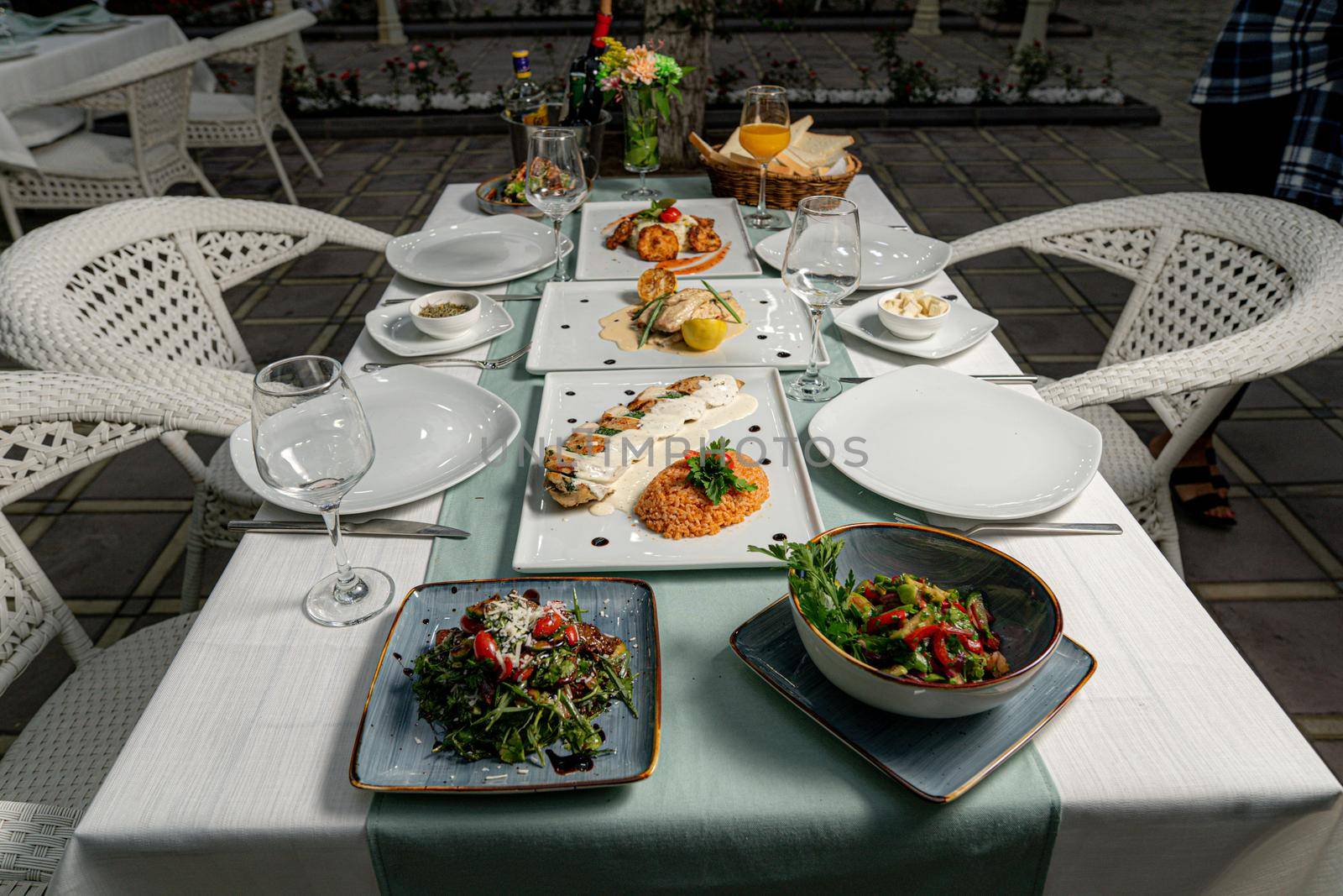 Glasses, fork, knife served for dinner in a restaurant by Djafarov