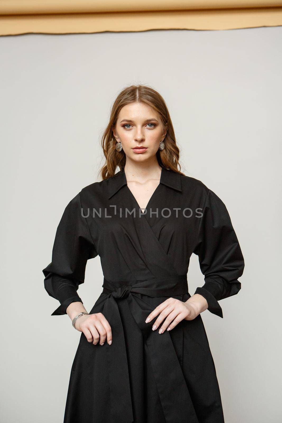 Fashion Portrait of Beautiful Model Girl wearing Black Dress
